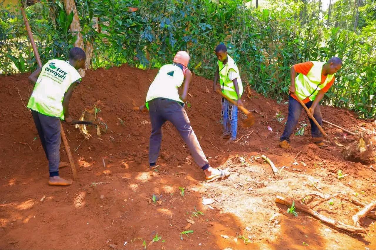 Community members levelling ground